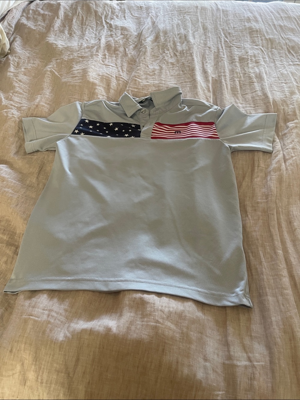 Travis Mathew Light Blue Polo with Stars & Stripes Chest Panels